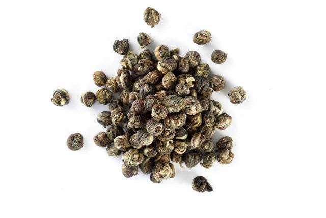 Loose jasmine tea leaves with a distinct floral aroma.