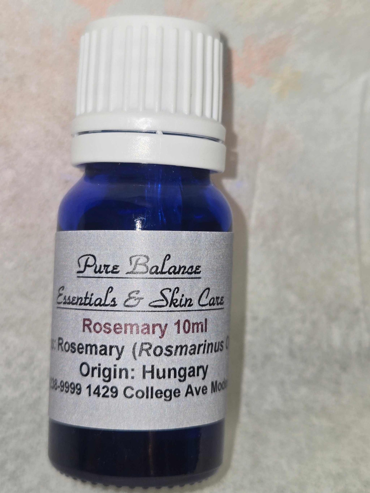 Blue glass bottle of Pure Balance Rosemary (Rosmarinus Officinalis) essential oil, 10 ml from Hungary.