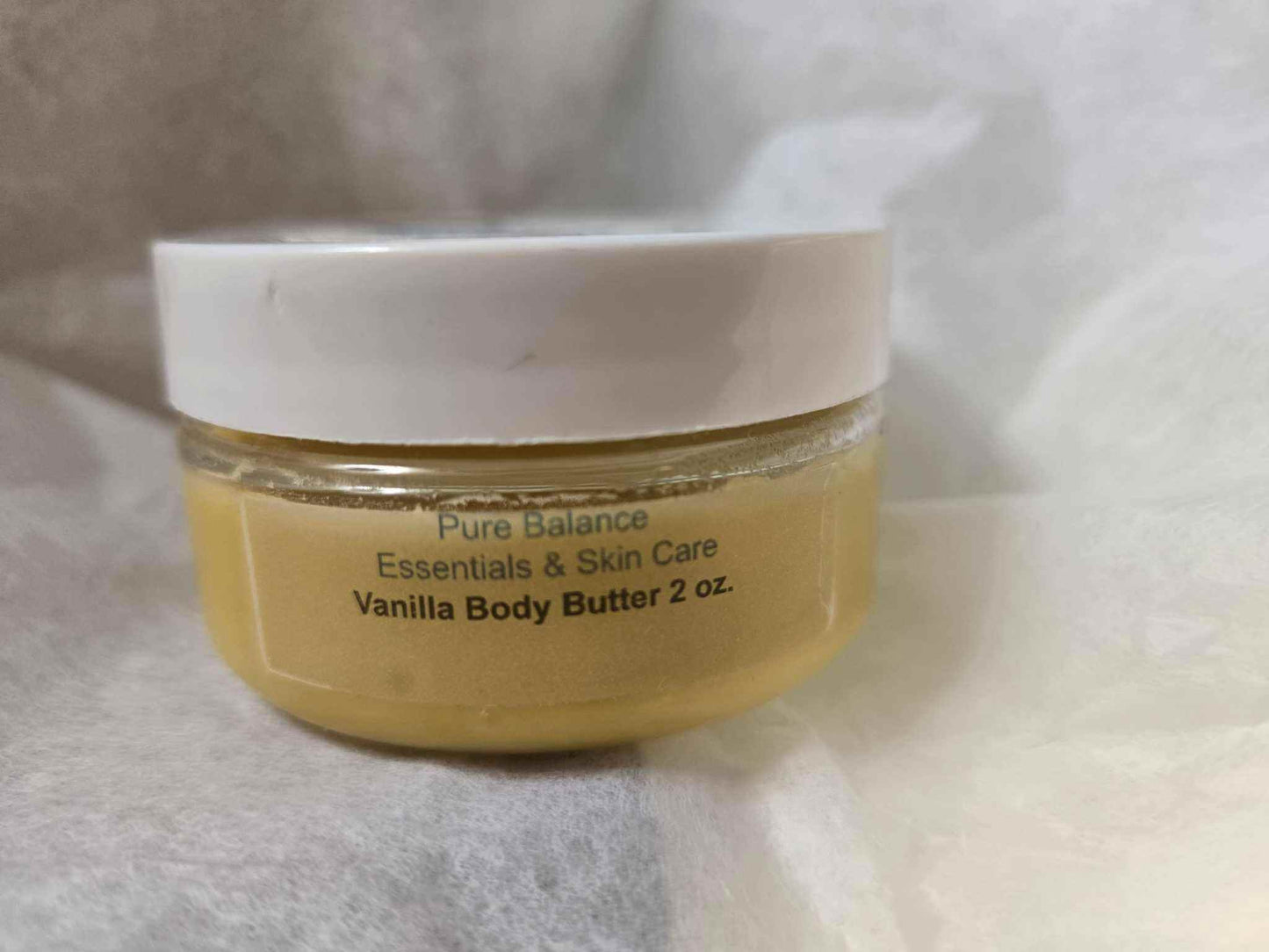 Vanilla Body Butter in 2oz jar with white lid, rich Madagascar vanilla aroma, suitable for skin protection.