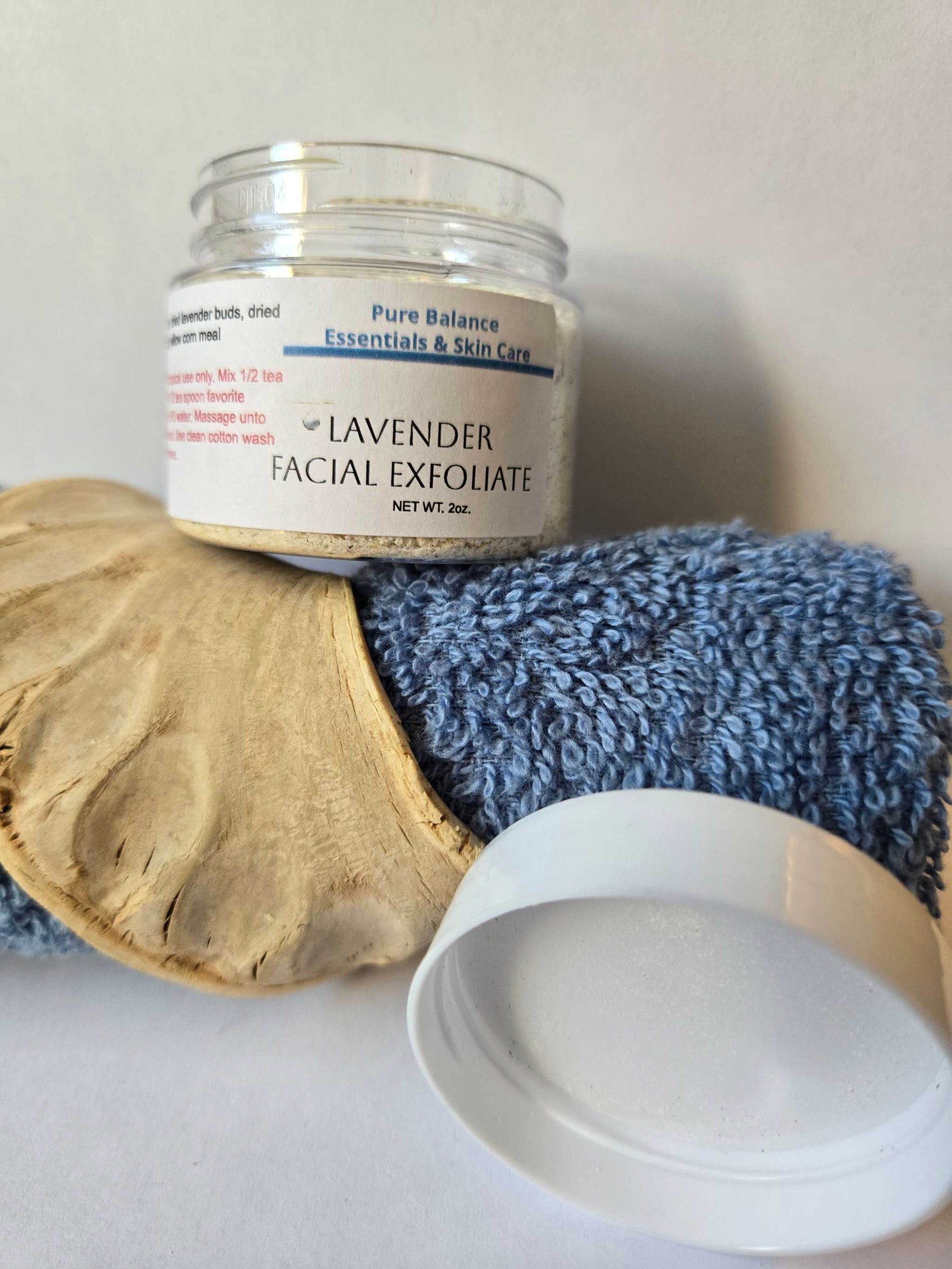 2oz jar of Lavender Facial Exfoliant for natural skin conditioning with lavender buds, milk, and cornmeal