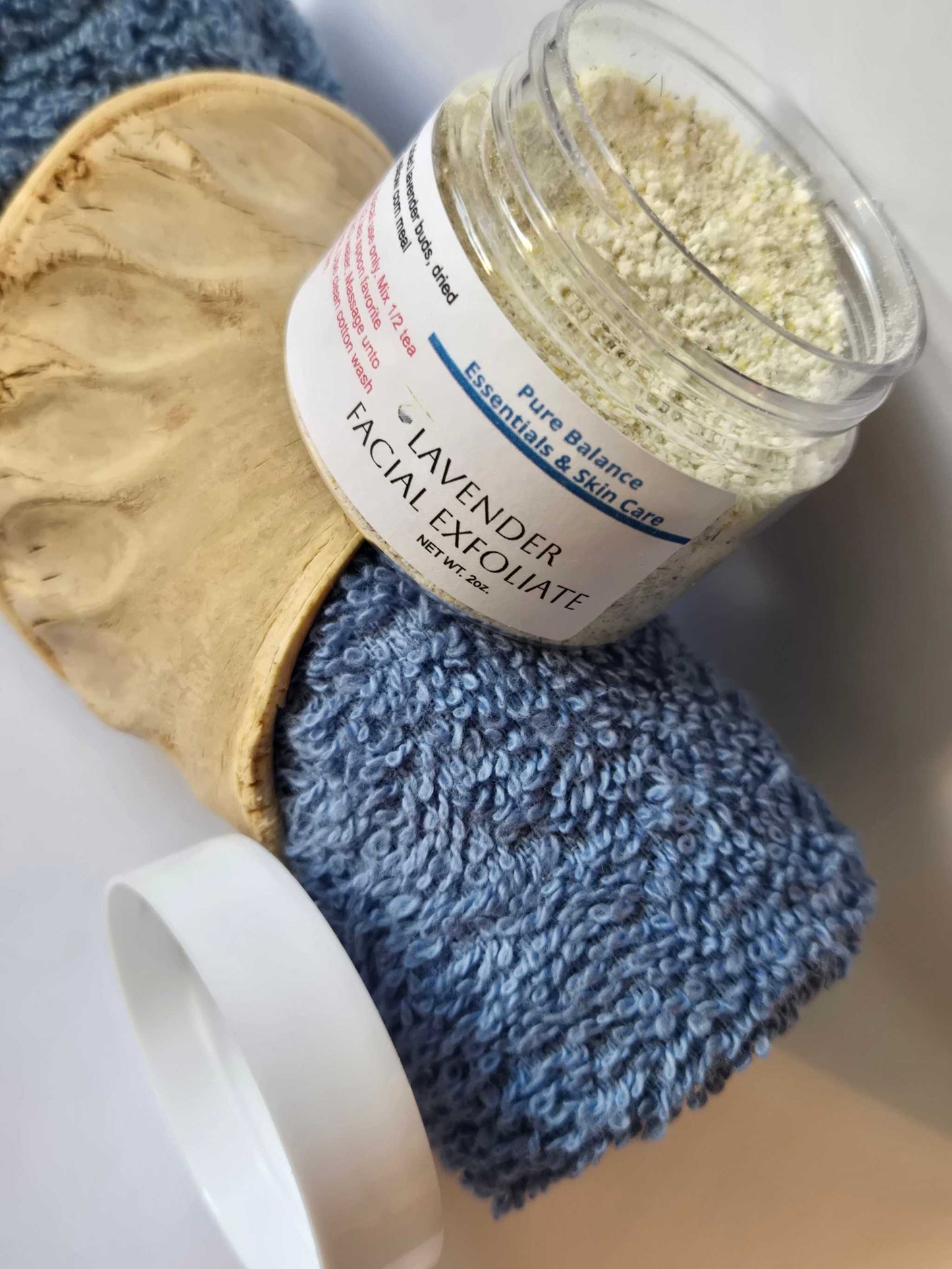 Lavender facial exfoliant jar with natural ingredients for skin conditioning experience